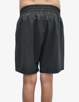 Black sports shorts with an elastic waistband, featuring a logo on the back.