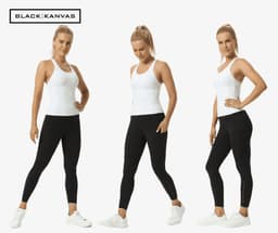 A pair of black leggings displayed on a model, featuring a logo, worn with a white tank top and white footwear.