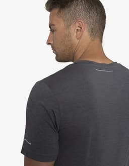 A grey T-shirt with short sleeves, featuring a logo on the back and a subtle design detail on the shoulder.