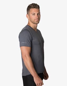 A grey T-shirt featured on a male model, displaying a fitted design and a logo on the sleeve.