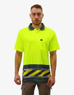 A bright yellow polo shirt with a dark collar and patterned bottom, featuring a logo on the chest pocket.