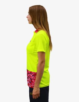 A bright yellow work polo shirt featuring a patterned pink and red bottom section. The shirt has a logo on it.