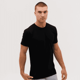 A black T-shirt displayed on a male model with a neutral background. The shirt has a logo on the front.