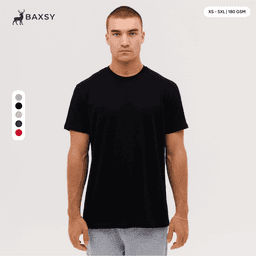 A black T-shirt featuring a classic fit, with a logo present, displayed on a model against a neutral background.
