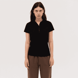 A women's black polo shirt with a button placket and short sleeves, featuring a logo on the chest.