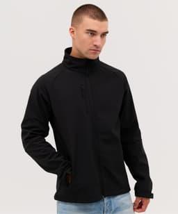 A black softshell jacket with a zippered front and a high collar, worn by a model.