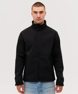 A black softshell jacket with a high collar, featuring a zip pocket and a fitted design.