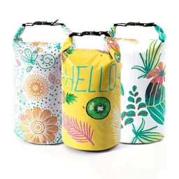 Three colourful waterproof dry bags in yellow, white, and a patterned design, featuring floral and tropical motifs.