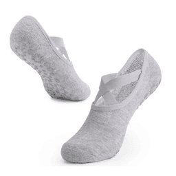 A pair of grey yoga socks with crisscross straps and textured soles for added grip. Features a logo.