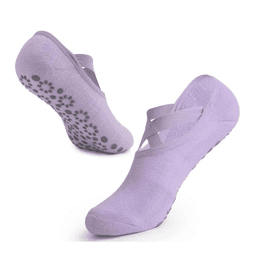 A pair of lavender yoga socks featuring cross straps and non-slip grips on the soles.