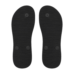 Black rubber soles of thongs with textured pattern and small circular buttons on the surface.