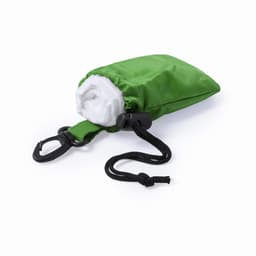 A green pouch containing a folded white poncho, with a black clip and drawstring for secure closure.