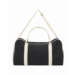 A black and cream two-tone canvas duffle bag with a shoulder strap and dual handles, featuring a logo.