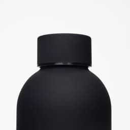 A drink bottle in matte black with a rounded body and a smooth cap. It features a logo on the surface.