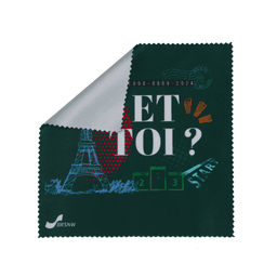 A large green microfibre cleaning cloth featuring graphic designs, including the Eiffel Tower and a logo.