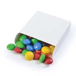 A box of colorful M&M's with green, blue, yellow, red, and brown choc beans spilling out.