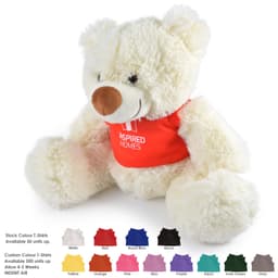 A plush teddy bear with a cream-colored body and a red shirt, featuring a sewn logo.