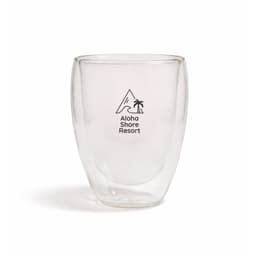 A drink bottle featuring a clear double wall design with a black logo and a mountain and palm tree graphic.
