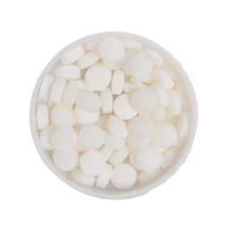 A round tin filled with small, round white mint candies.