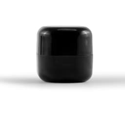 A black cube lip balm container with a glossy finish and rounded edges, featuring a simple design.