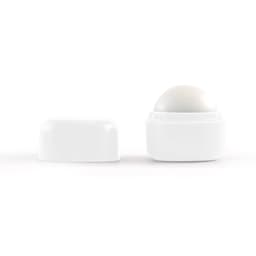 A white cube lip balm with a round top, featuring a removable lid. Simplistic design with no visible branding.