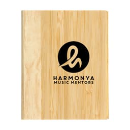 A wooden bamboo cover notebook featuring a circular logo with stylized lettering in black.