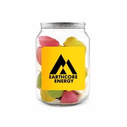 A clear jar filled with colourful jelly sweets in pink, yellow, green, and white, featuring a logo.