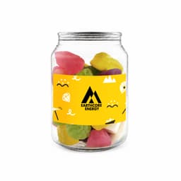 A clear jar containing colourful jelly sweets in various shapes, with a logo on the label.