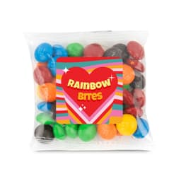 A 50-gram cello bag filled with colorful choc beans, branded as "Rainbow Bites."