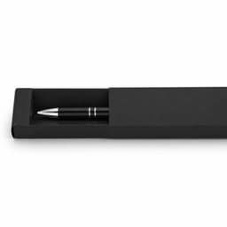 A black gel ink pen displayed in a sleek black box, featuring a simple design and metallic accents.