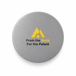 A round, grey promotional product featuring a logo and text about sustainability.