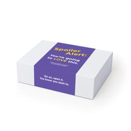 A rectangular white box with a purple label, featuring text and a logo. The box has a smooth surface.