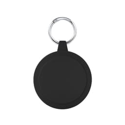A round black keychain holder features a silver keyring. The surface is smooth with subtle grooves around the edge.