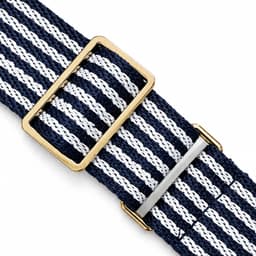 A navy and white striped belt featuring a gold buckle and silver metal detailing.