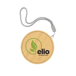 A bamboo wireless charger with a circular design and a silver strap, featuring a logo on the surface.