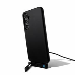 A black phone case with a built-in stand, featuring a charging cable connected to it.