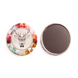 A colourful 75mm round magnet featuring a deer illustration with glasses, set against a geometric pattern.