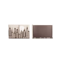 A rectangular magnet featuring a city skyline design in neutral tones with a glossy finish and a logo.