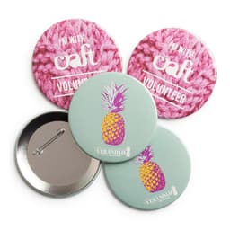 Four round badges, two with a pink knitted background and one featuring a pineapple design on a light green background.