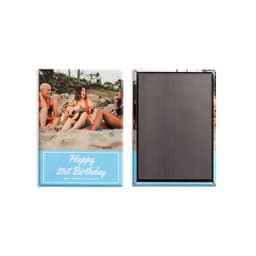 A rectangular custom magnet featuring a colourful beach scene with text on the front and a plain black back.