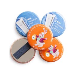 A round magnet fastener badge set featuring colourful designs, including a character and product logos, with varying colours.