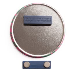 A round magnet fastener badge in vibrant colours with a metal backing and a prominent magnetic strip.