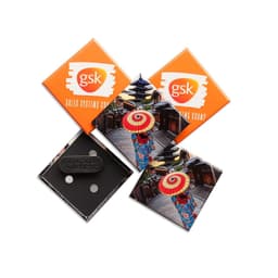 Custom 50mm x 50mm diamond-shaped magnets in orange and multi-coloured designs, featuring a logo and magnetic backing.