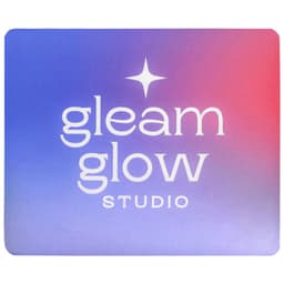 A mouse pad featuring a gradient design in purple and pink with a logo in the centre.