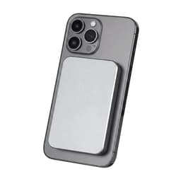 A silver power bank attaches magnetically to the back of a grey smartphone, featuring a sleek design.