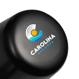 A black lamp with a rounded top featuring a logo design. The lamp is compact and rechargeable.