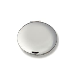 A silver compact mirror with a sleek, reflective surface and a clasp closure.