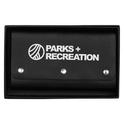 A black leather travel card set with a branded cover, featuring a snap closure. Packed in a matching box.