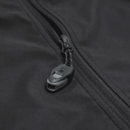 A black softshell jacket featuring a zip closure and a branded pull tab.