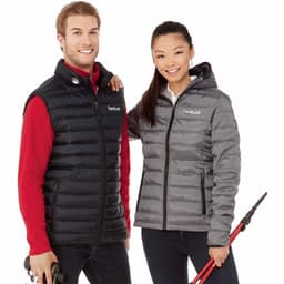A black insulated vest worn by a man and a grey insulated jacket worn by a woman, both featuring branding.